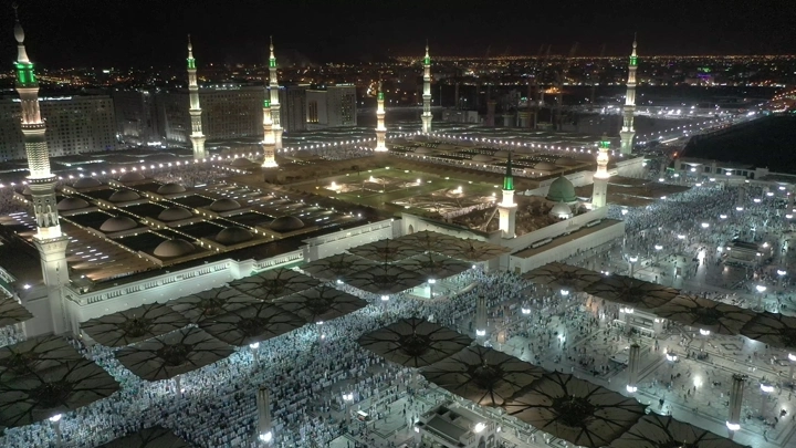 Prophet's Mosque in Medina at night, aerial view.