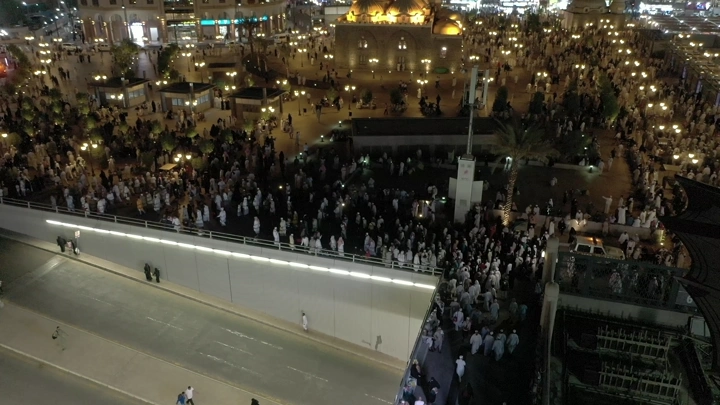 Prophet's Mosque in Medina at night, aerial view.