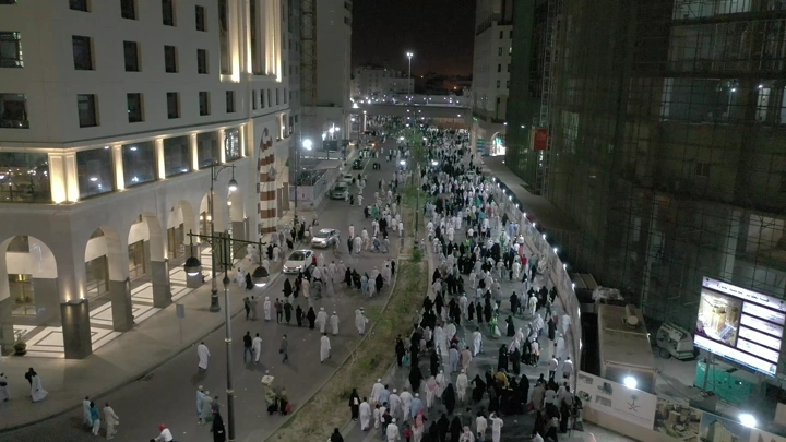 Crowds of people in Medina at night, aerial shot.