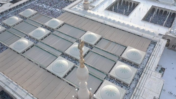 Prophet's Mosque in Medina, aerial view showing domes and courtyards.