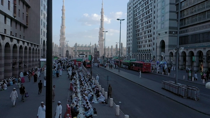 Busy street near Al-Masjid an-Nabawi in Medina, aerial shot.