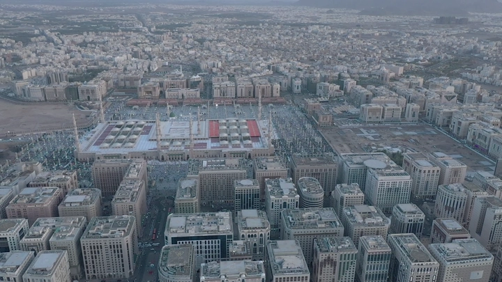 Prophet's Mosque in Medina, daytime aerial shot.