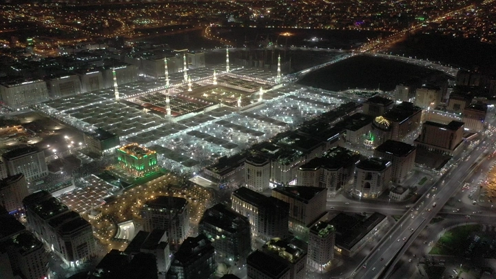 Prophet's Mosque in Medina at night, aerial view.