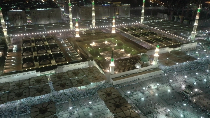 Prophet's Mosque in Medina at night, aerial view.