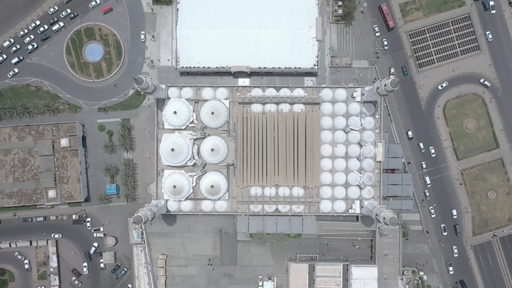 Aerial view of Quba Mosque in Medina, showcasing architectural design and surrounding courtyards.