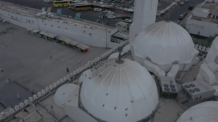 Quba Mosque in Medina, aerial shot showing domes and surroundings.