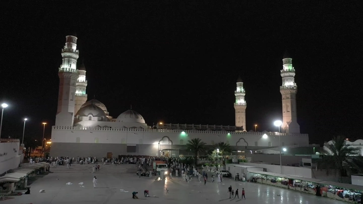 Quba Mosque in Medina at night, wide view.