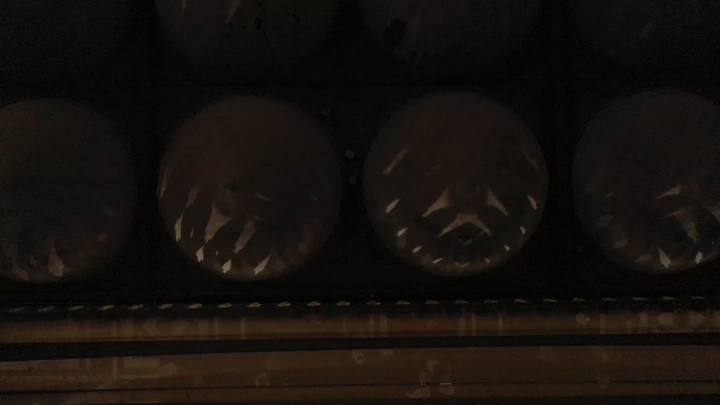 Domes of Quba Mosque at night, shot from below.
