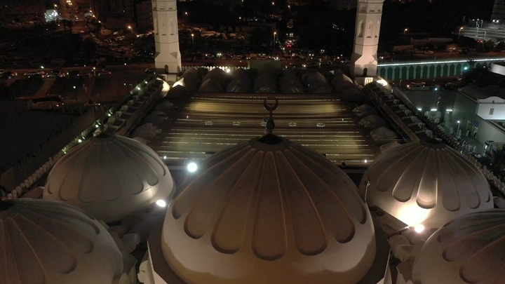 Quba Mosque in Medina at night, aerial shot.