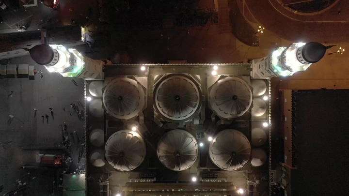 Aerial view of Quba Mosque in Medina at night.