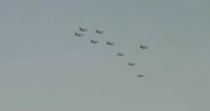 Formation of planes in the sky during an air show, daytime shot.