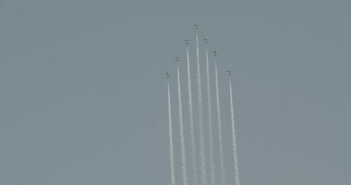 Planes in aerial formation during National Day, shot from below.