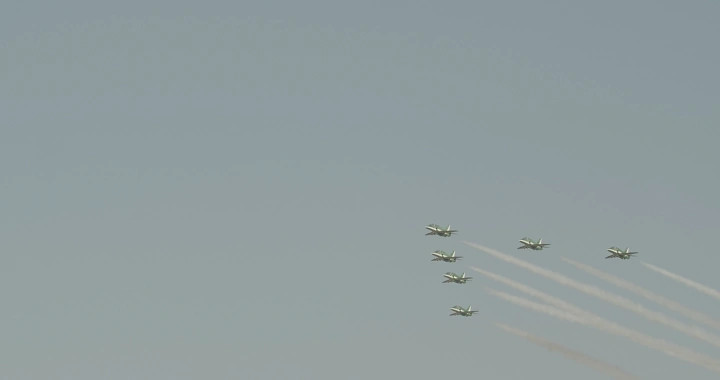 Planes flying in formation during National Day, long shot.
