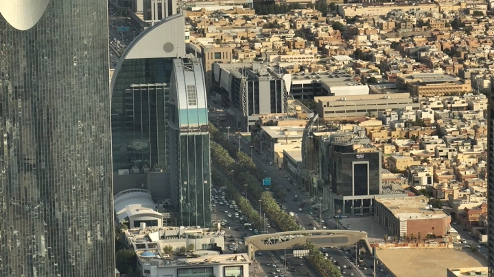 Aerial view of Riyadh towers and surrounding buildings in daylight.