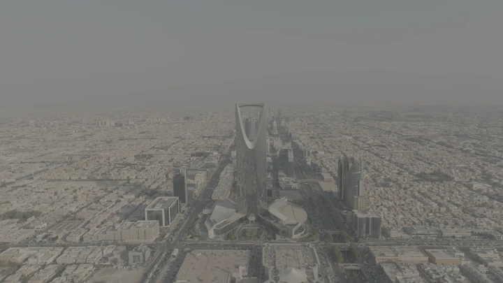 Aerial view of Riyadh Towers on a cloudy day, shot with a drone.