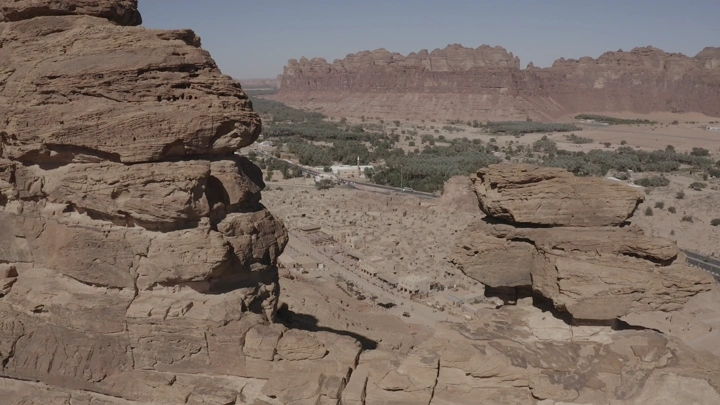 Massive rocks overlooking the old town of AlUla, aerial shot.