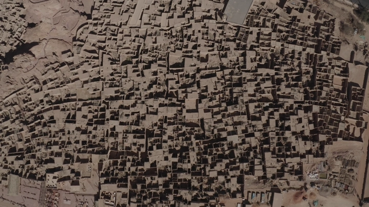 Aerial view of AlUla Old Town, showcasing densely packed mudbrick buildings.