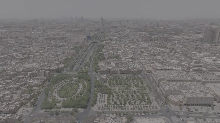 Aerial shot of Riyadh city with King Fahd Road Park, drone shot.