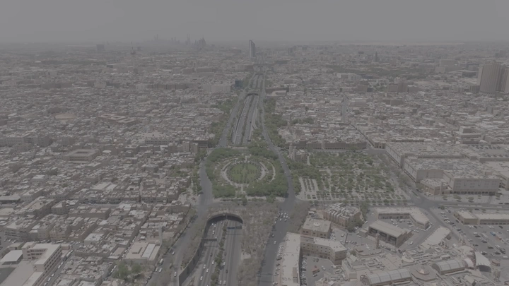 Aerial shot of Riyadh city with King Fahd Road Park, drone shot.