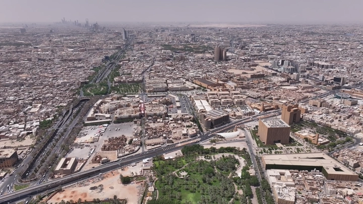 Aerial view of Riyadh city with King Fahd Road Park, drone shot.