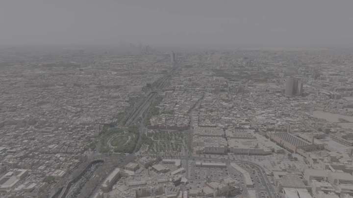 Aerial shot of Riyadh city with King Fahd Road Park, drone shot.