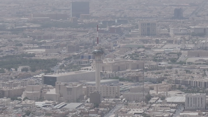 Aerial shot of Riyadh towers during the day, drone photography.