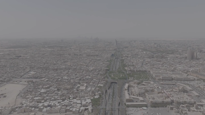 Aerial shot of Riyadh city with King Fahd Road Park, drone shot.