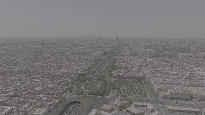 Aerial shot of Riyadh city with King Fahd Road Park, drone shot.