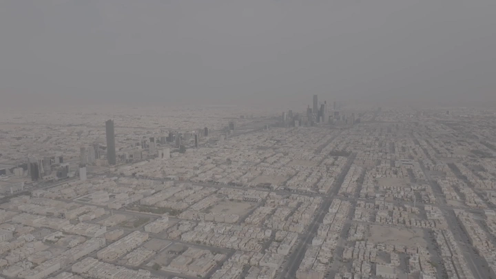 Aerial view of Riyadh Towers on a cloudy day, shot from a drone.