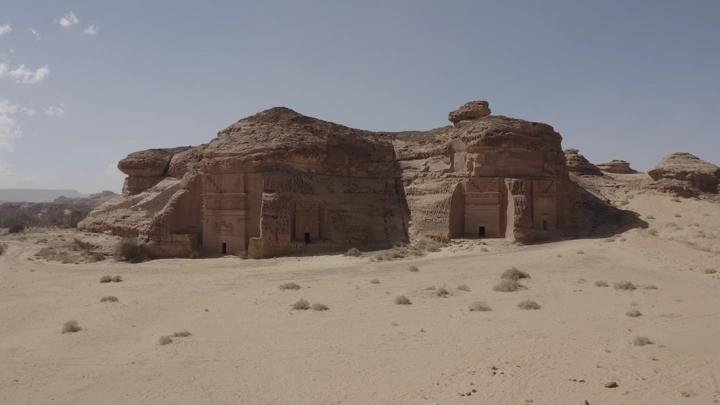 The archaeological site of Al-Hijr (Madain Salih) in Al-Ula under the clear sky, aerial shot.