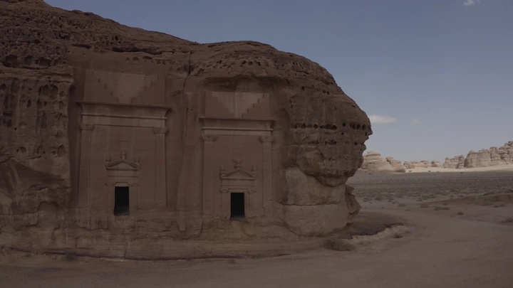 The archaeological site of Al-Hijr (Madain Salih) in Al-Ula under the clear sky, aerial shot.