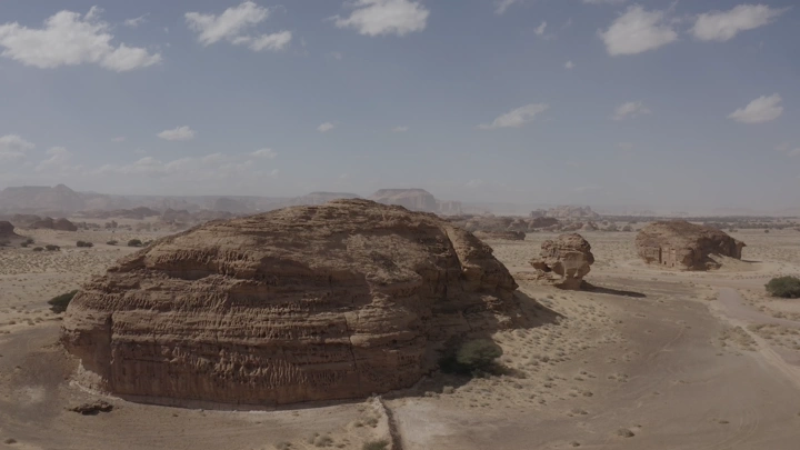 Rock formations at Madain Saleh in AlUla, daytime aerial shot.