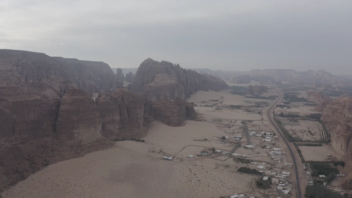 Mountains and farms of AlUla during the day, aerial view.