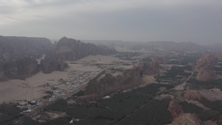Mountains and farms in AlUla in the morning, aerial shot.