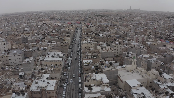 Aerial view of Riyadh neighborhoods on a cloudy day.