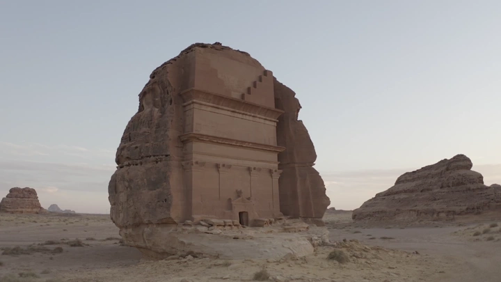 Qasr Al-Farid in Madain Saleh, aerial shot at sunset.