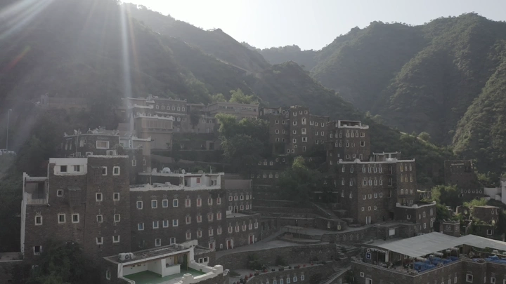 Rijal Alma Village in the Asir region, daytime photograph.