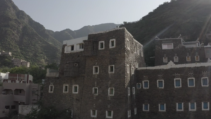 Traditional buildings in Rijal Alma, Asir region, daytime shot.