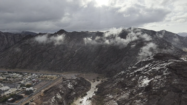 Mountains of Aja under the clouds in Hail, aerial shot.
