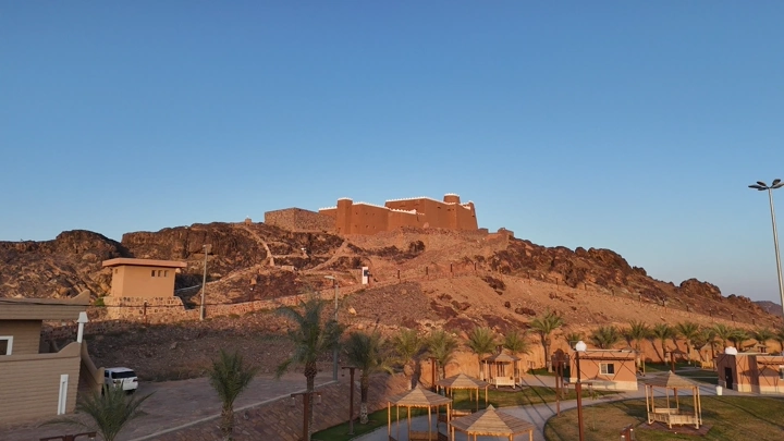 Aerial view of the historical A'arif Castle in Hail at sunset.
