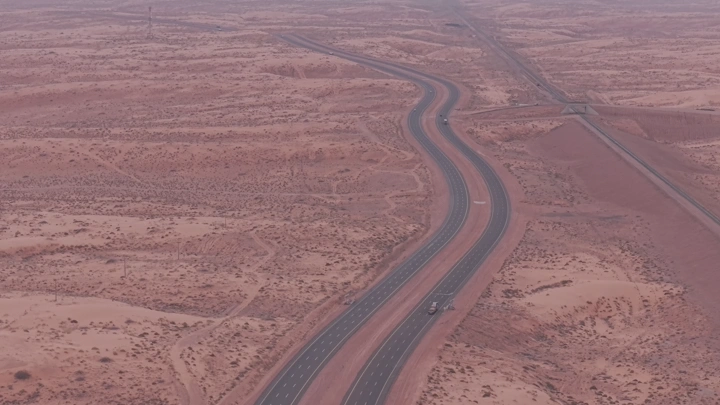 A highway stretches across the desert of Hail, aerial shot.