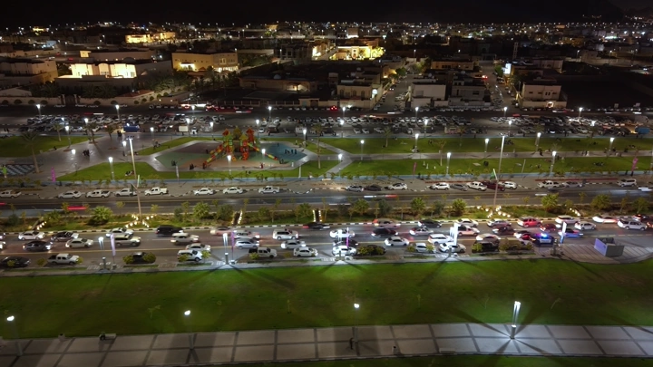 Busy road in Ha'il city at night, drone shot.