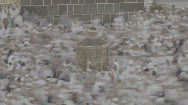 Crowds circumambulate around the Kaaba in the Grand Mosque, hyperlapse shot.