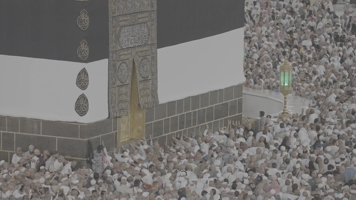 Kaaba surrounded by pilgrims at Al-Masjid Al-Haram, aerial view.