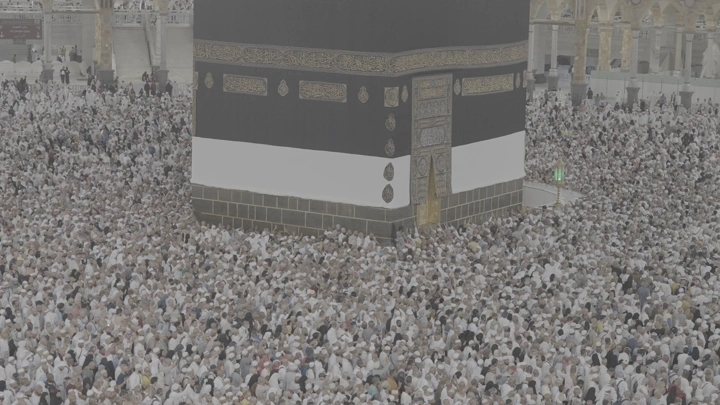 Kaaba in Mecca surrounded by pilgrims, aerial view.