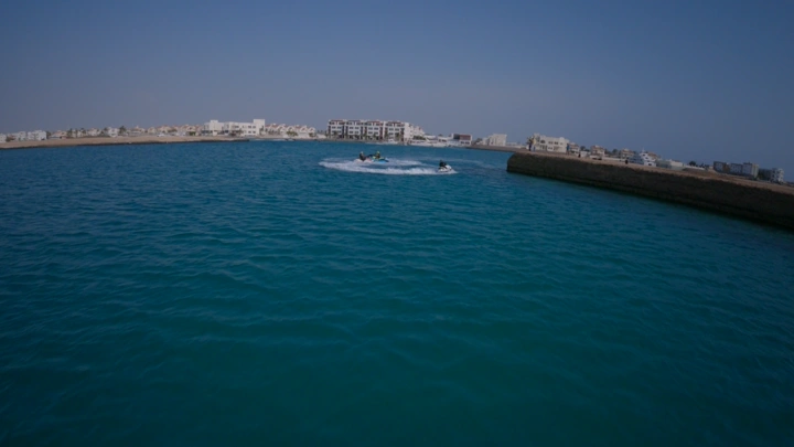 Jet skis in the blue waters of Jeddah, drone shot.