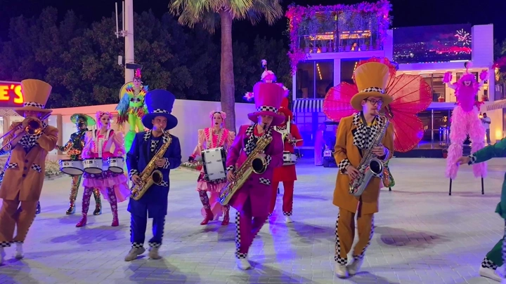 A musical band plays music at the Yanbu Flowers and Gardens Festival, a night shot.
