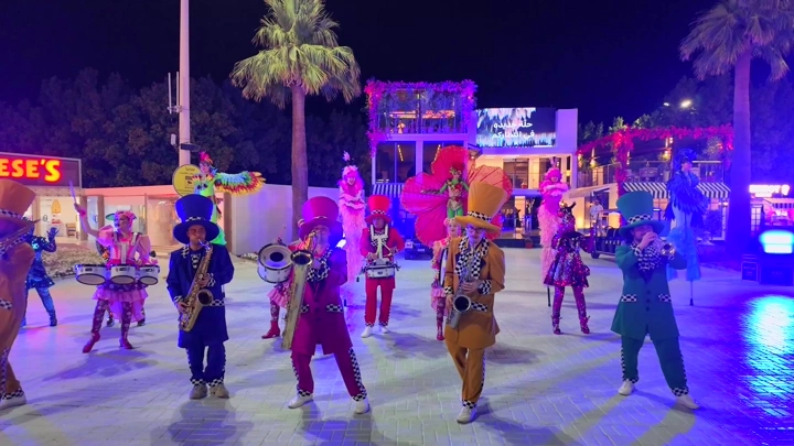 A performance troupe at the Flower Festival in Yanbu Industrial City, night shot.