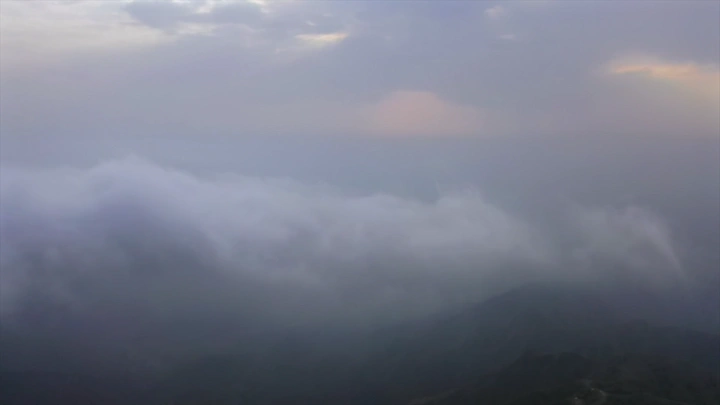Thick fog covers the Black Mountains in Jazan in the morning, aerial shot.