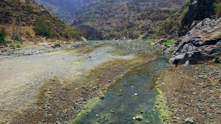 The death scene in the Valley of Life in Jazan with a water stream, daytime shot.